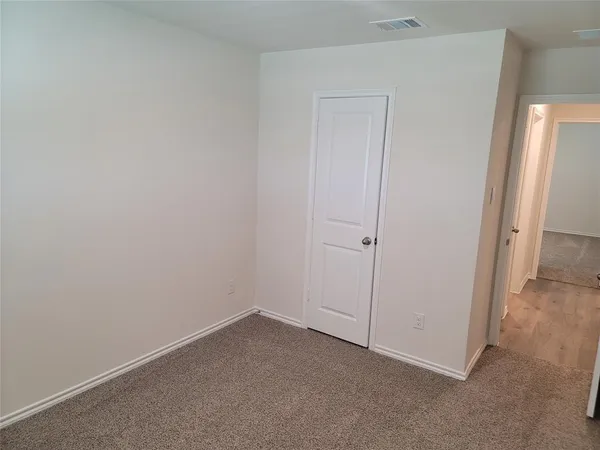 an empty room with a hallway