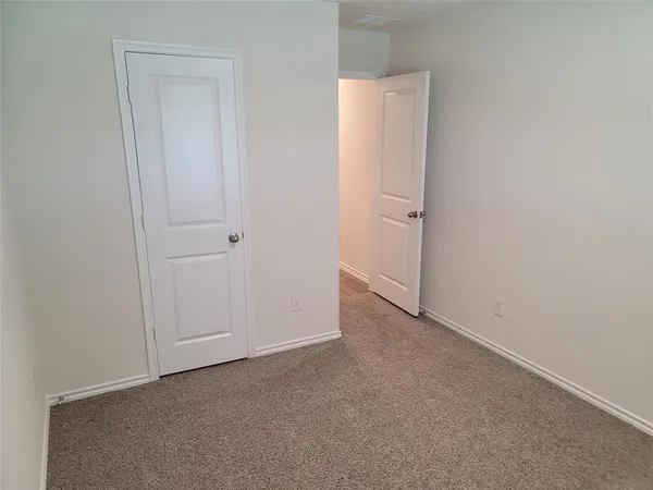 a kitchen with stainless steel appliances granite countertop a stove a refrigerator and a microwave