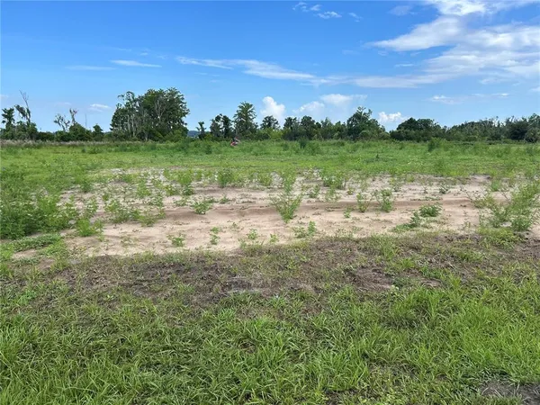 a view of a golf course with green space