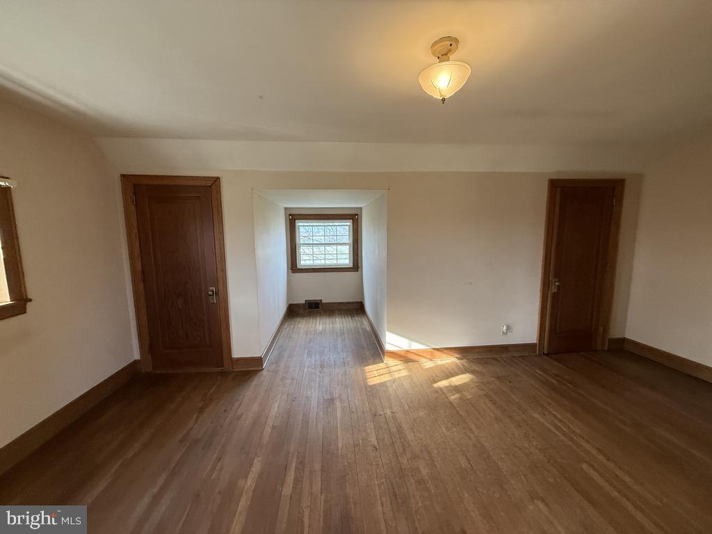 6245 Middleburg Road Keymar, MD 21757 - Photo 59 of 77 an empty room with wooden floor and windows