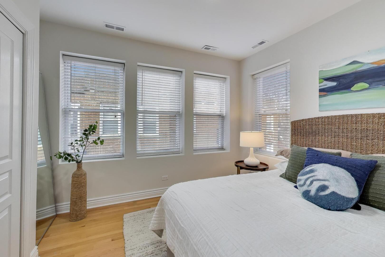 1443 West Victoria Street, Unit 3E Chicago, IL 60660 - Photo 11 of 18 a bedroom with a bed and window