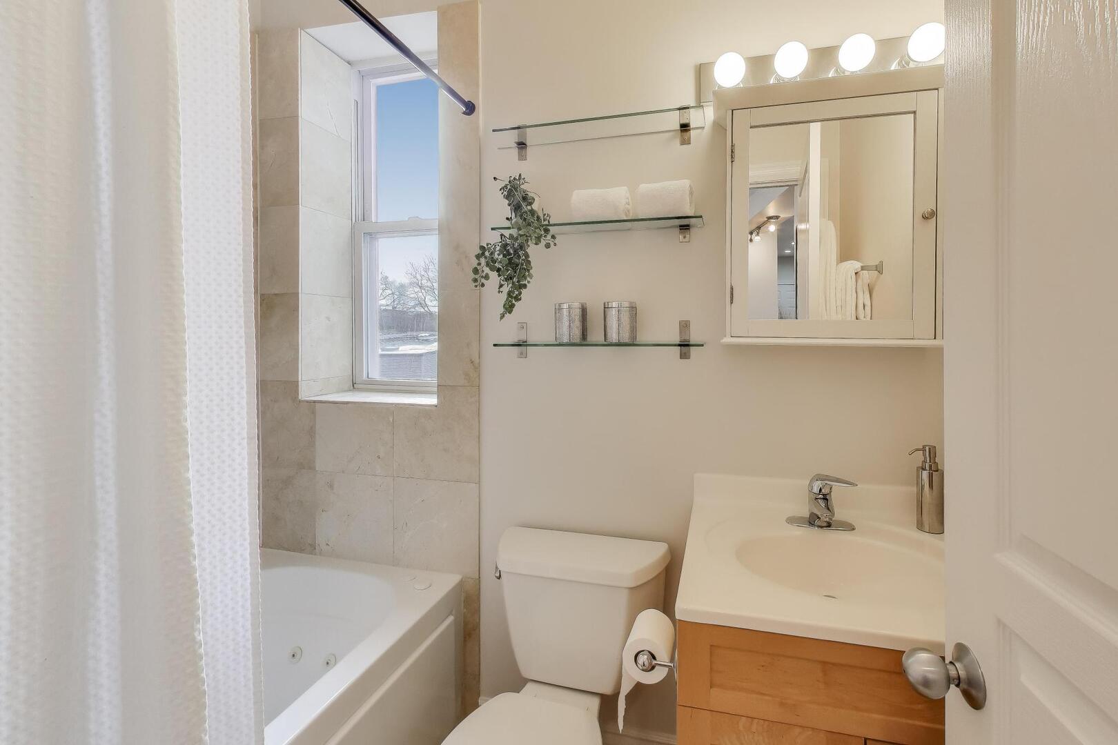 1443 West Victoria Street, Unit 3E Chicago, IL 60660 - Photo 14 of 18 a bathroom with a sink a toilet and shower