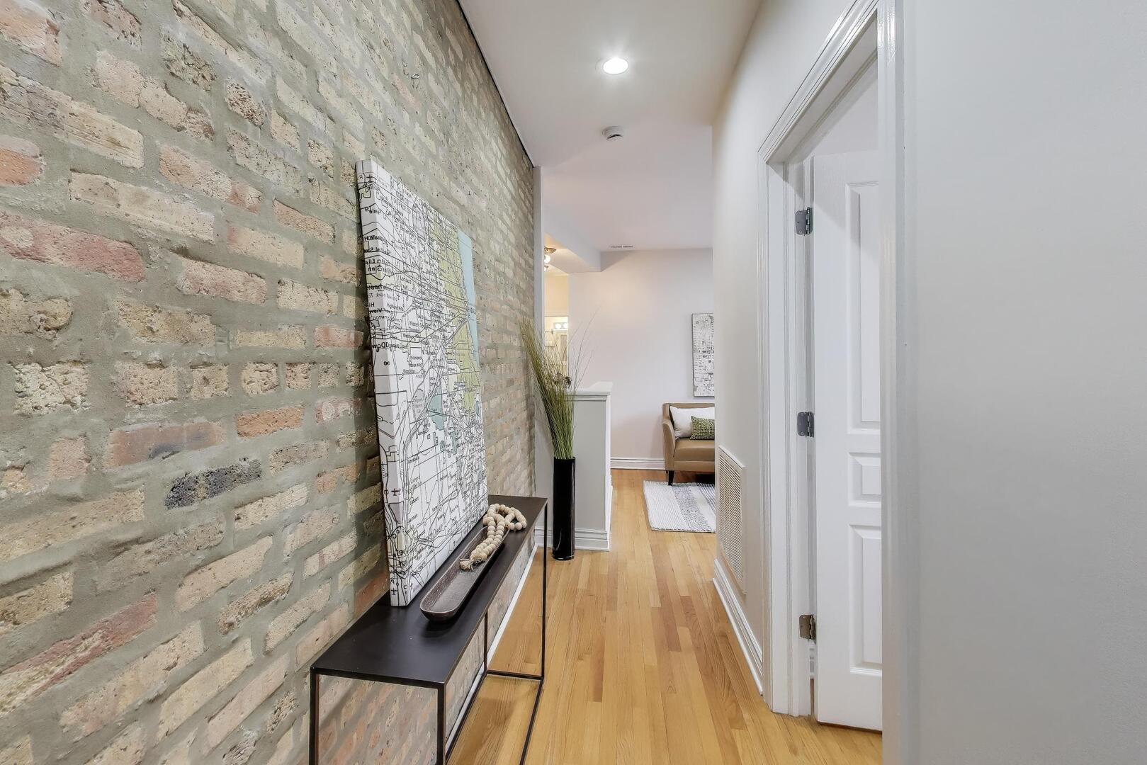 1443 West Victoria Street, Unit 3E Chicago, IL 60660 - Photo 2 of 18 a bathroom with a bathtub and shower