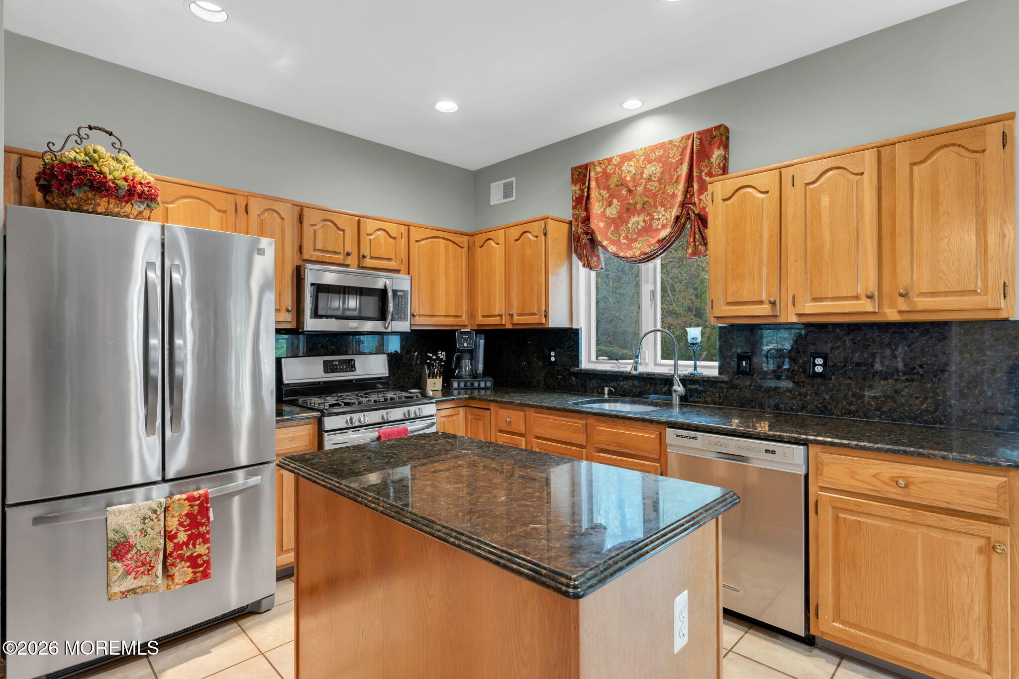 4 Quaker Hill Road Jackson, NJ 08527 - Photo 33 of 70 a kitchen with stainless steel appliances granite countertop a refrigerator a stove and a sink