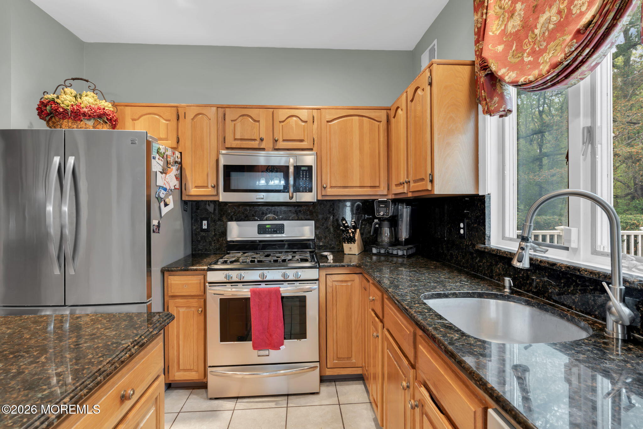 4 Quaker Hill Road Jackson, NJ 08527 - Photo 34 of 70 a kitchen with stainless steel appliances granite countertop a sink a stove and a refrigerator