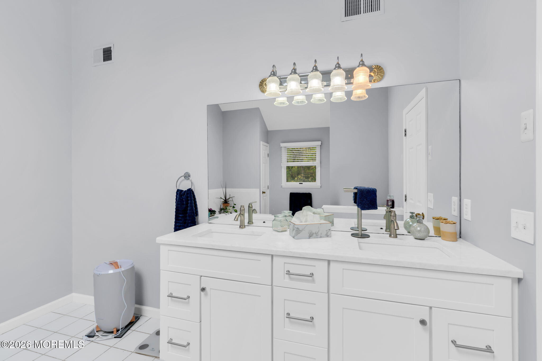 4 Quaker Hill Road Jackson, NJ 08527 - Photo 44 of 70 a bathroom with a sink vanity and a mirror