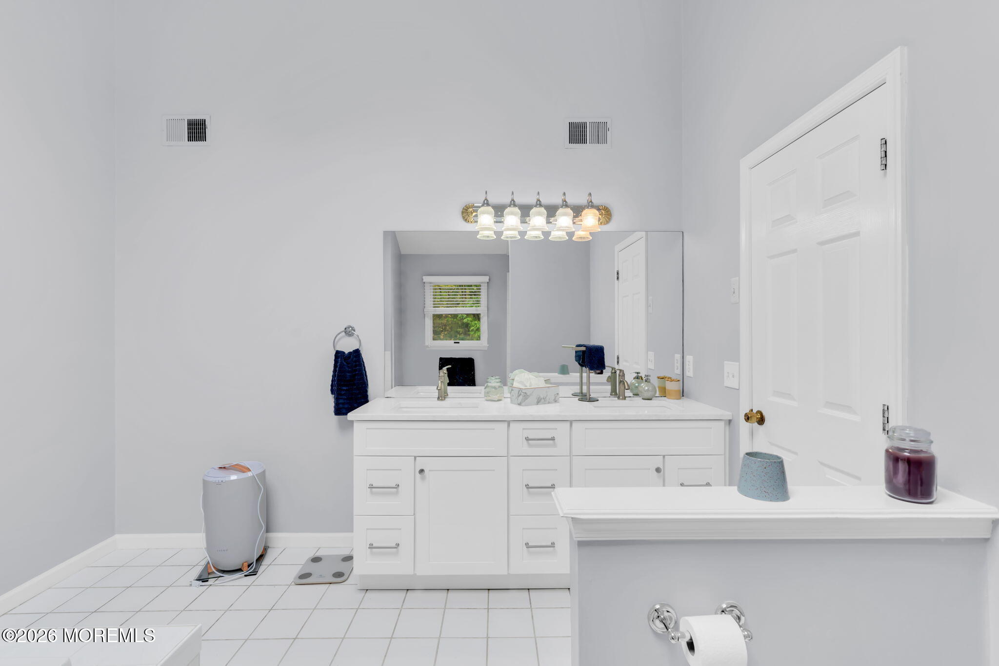 4 Quaker Hill Road Jackson, NJ 08527 - Photo 45 of 70 a bathroom with a sink and a mirror