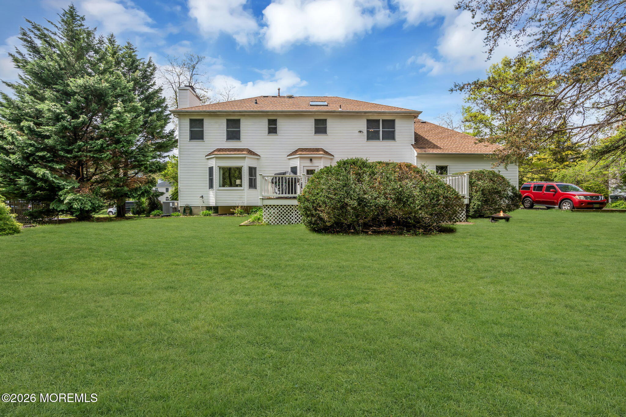 4 Quaker Hill Road Jackson, NJ 08527 - Photo 63 of 70 a front view of a house with a garden
