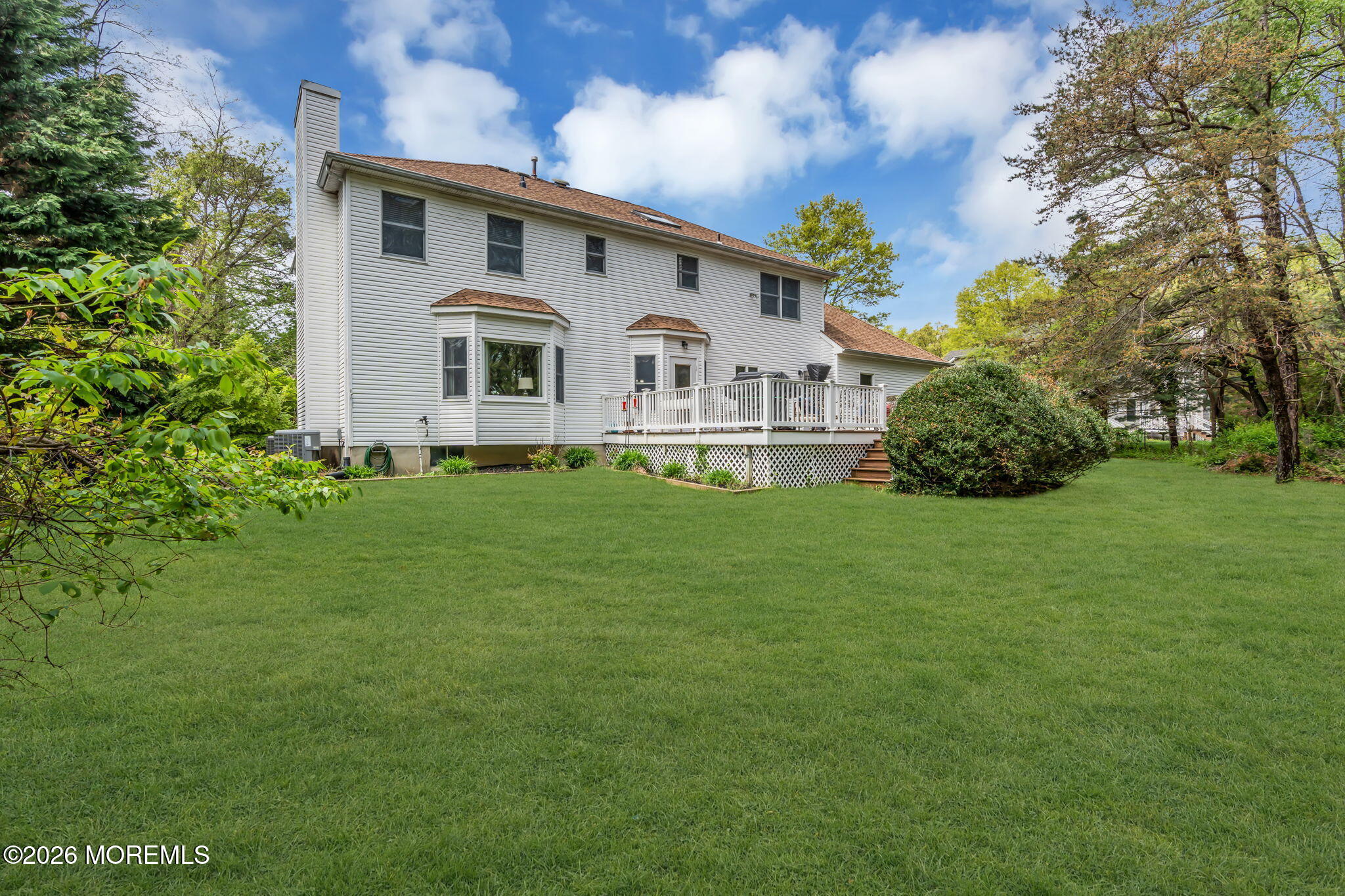 4 Quaker Hill Road Jackson, NJ 08527 - Photo 65 of 70 a front view of a house with a garden