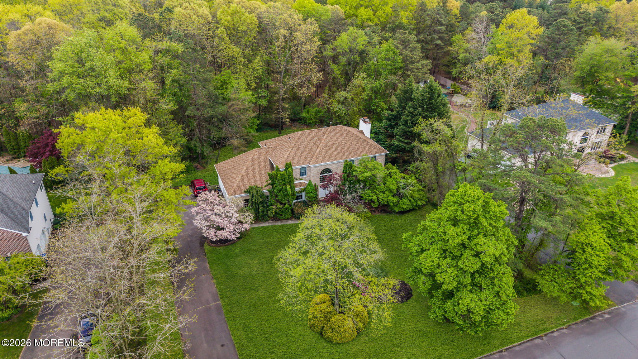4 Quaker Hill Road Jackson, NJ 08527 - Photo 68 of 70 a view of a garden with plants and large trees
