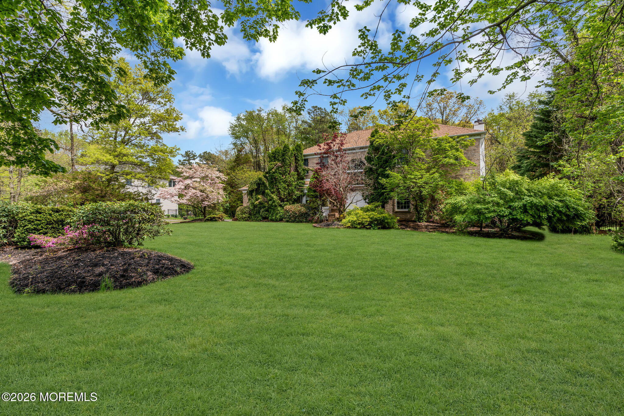 4 Quaker Hill Road Jackson, NJ 08527 - Photo 7 of 70 a view of a garden with a building in the background