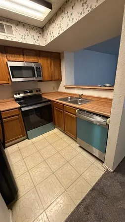 a kitchen with a stove and a microwave