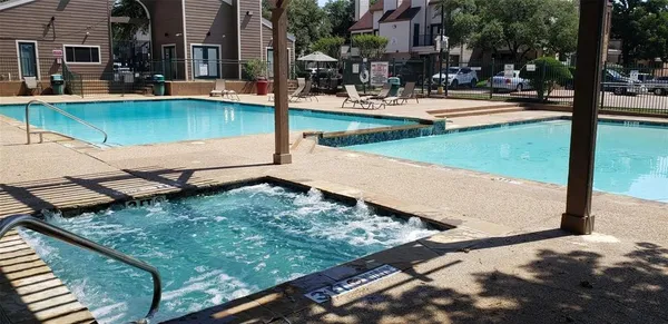 a view of a swimming pool with a patio