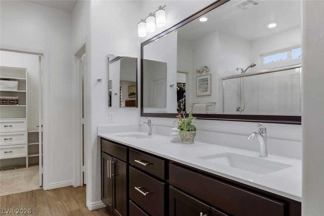 2922 Ventana Ridge Avenue Henderson, NV 89044 - Photo 27 of 57 The sinks were upgraded as a raised vanity with quartz countertops in White Harvest color.