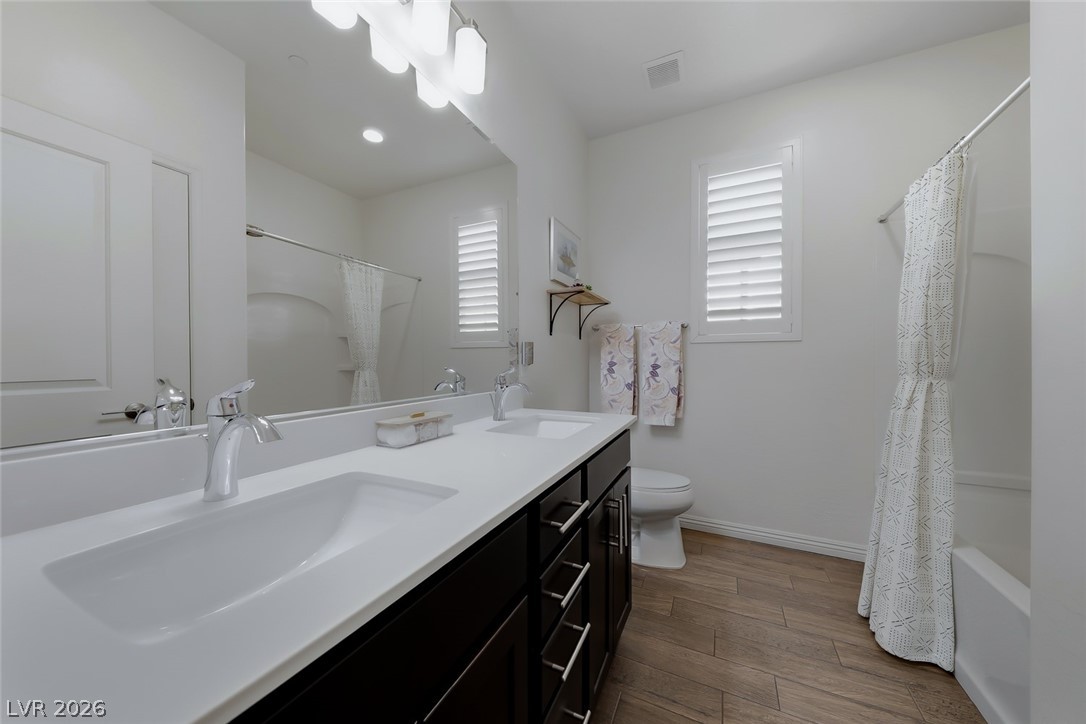 2922 Ventana Ridge Avenue Henderson, NV 89044 - Photo 34 of 57 Guest Bathroom located between Guest Bedrooms #2 and #3. This bathroom was upgraded with an extended vanity and two sinks.