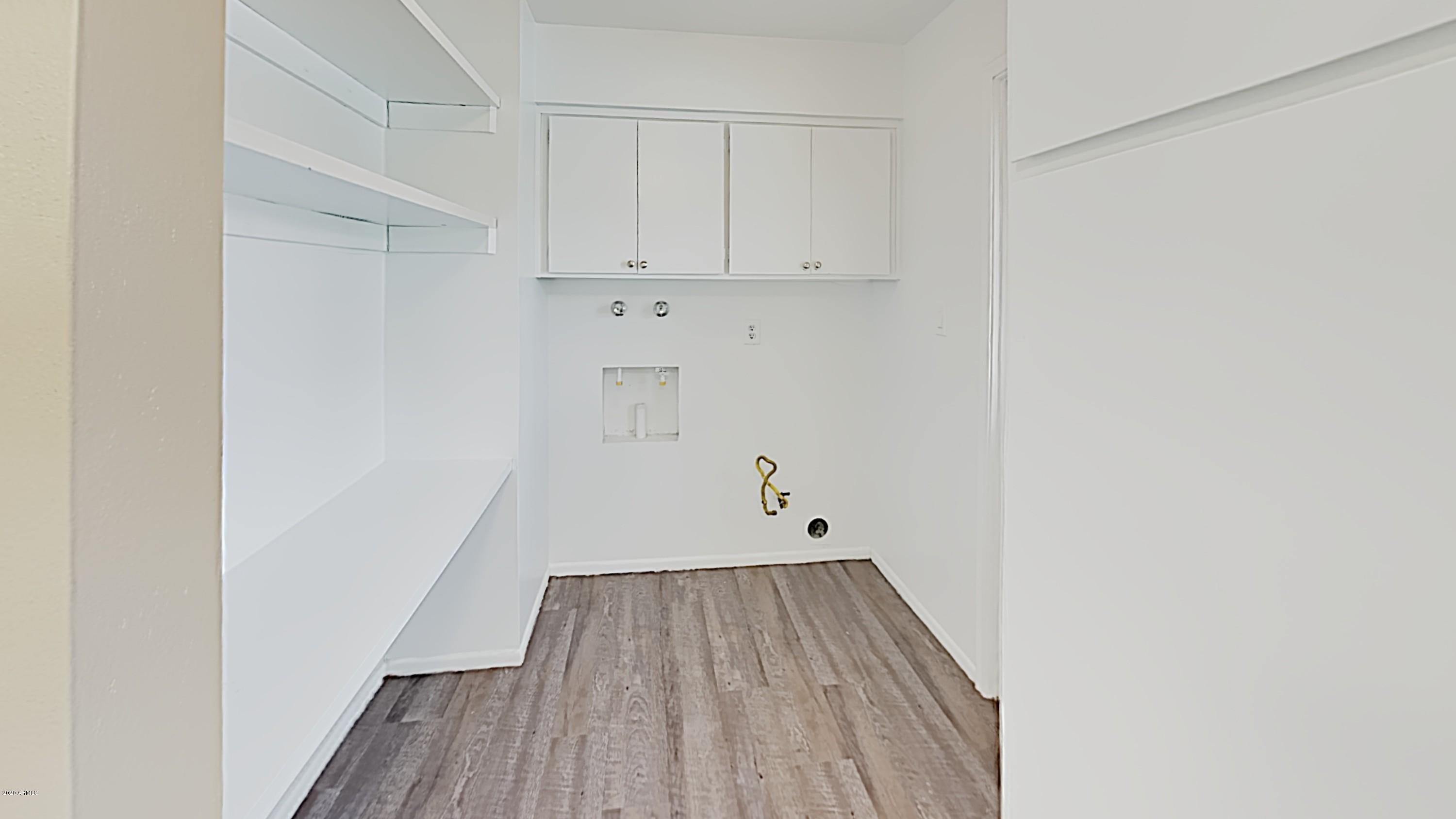 4110 West Hatcher Road Phoenix, AZ 85051 - Photo 9 of 19 a view of a room with wooden floor
