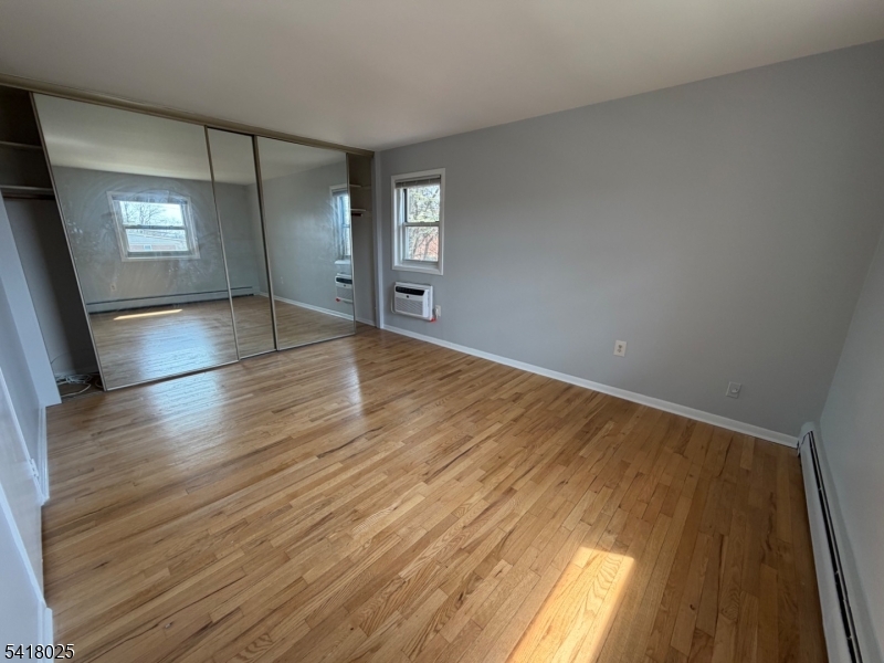 16 Knox Terrace Wayne, NJ 07470 - Photo 5 of 12 wooden floor in an empty room with a window