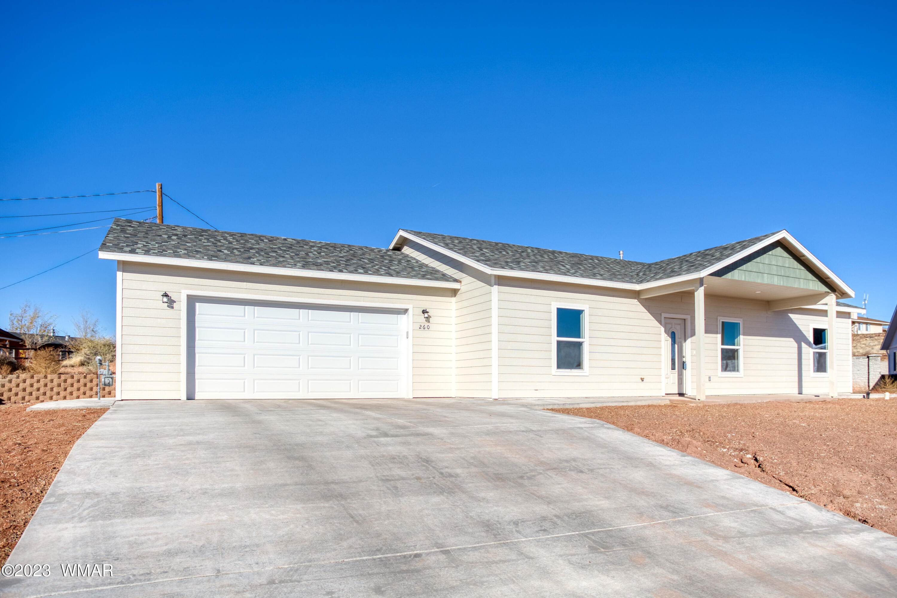 260 Granite Circle Taylor, AZ 85939 - Photo 1 of 11 a view of a house with a yard and garage