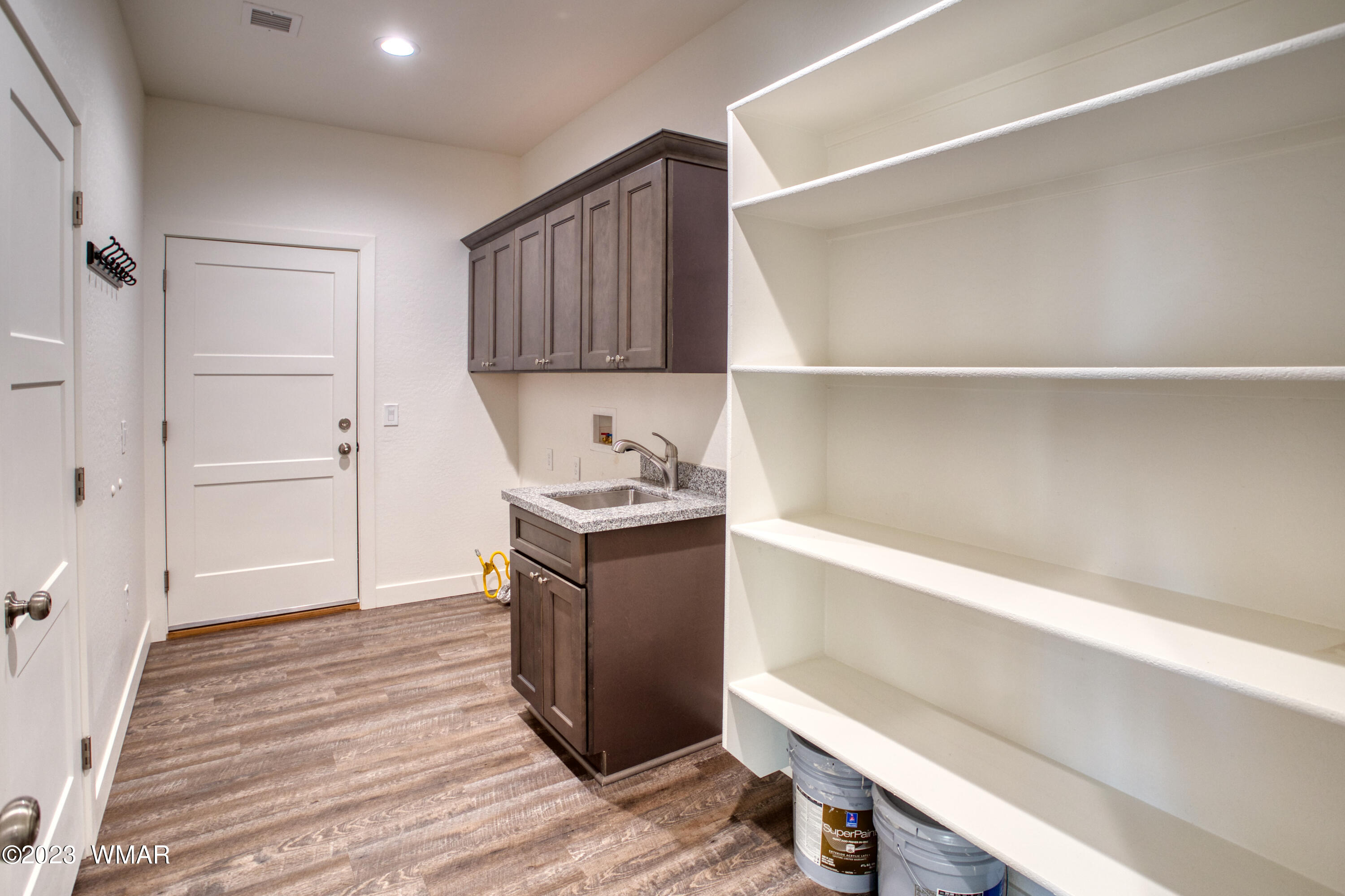260 Granite Circle Taylor, AZ 85939 - Photo 11 of 11 a room with a cabinets and wooden floor