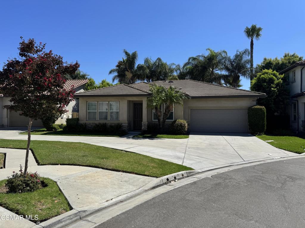 1604 Rose Arbor Lane Simi Valley, CA 93065 - Photo 1 of 16 a front view of a house with a yard and garage