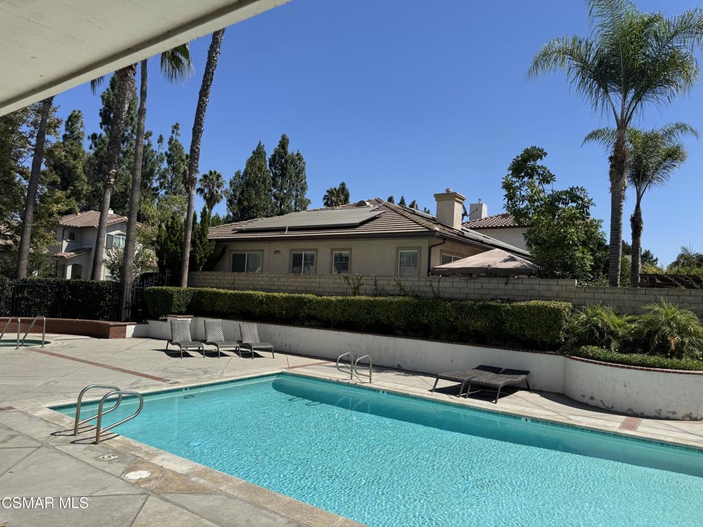 1604 Rose Arbor Lane Simi Valley, CA 93065 - Photo 15 of 16 a view of a house with swimming pool and sitting area