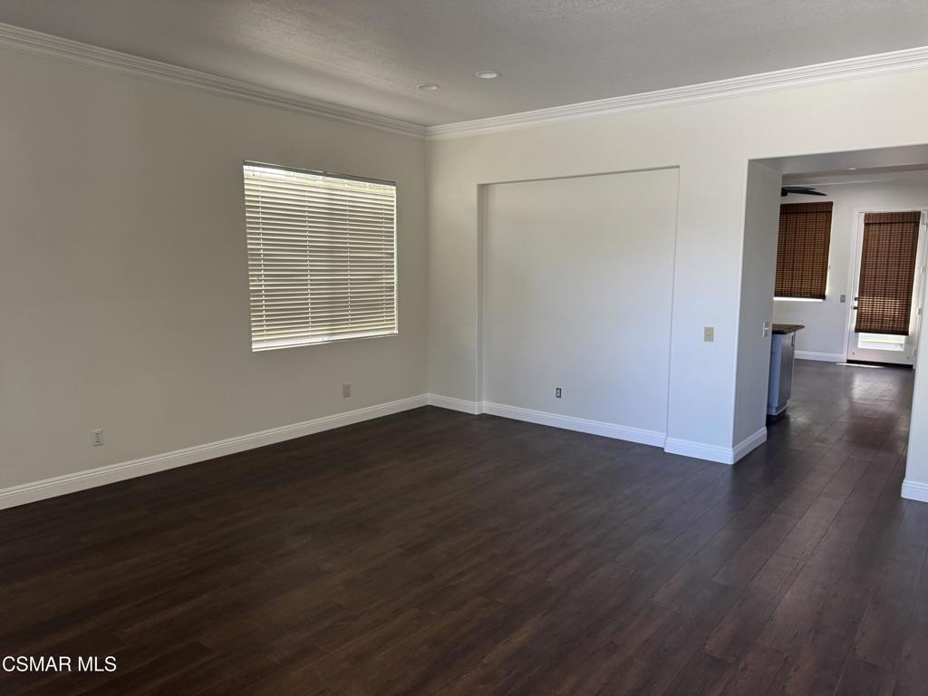 1604 Rose Arbor Lane Simi Valley, CA 93065 - Photo 3 of 16 an empty room with wooden floor and windows