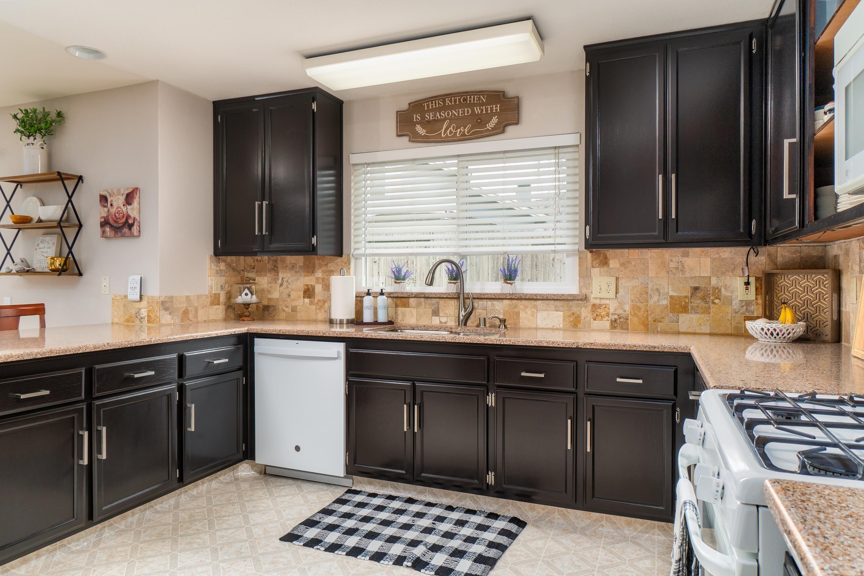 1337 Jason Drive Lompoc, CA 93436 - Photo 8 of 26 a kitchen with a sink stove and cabinets