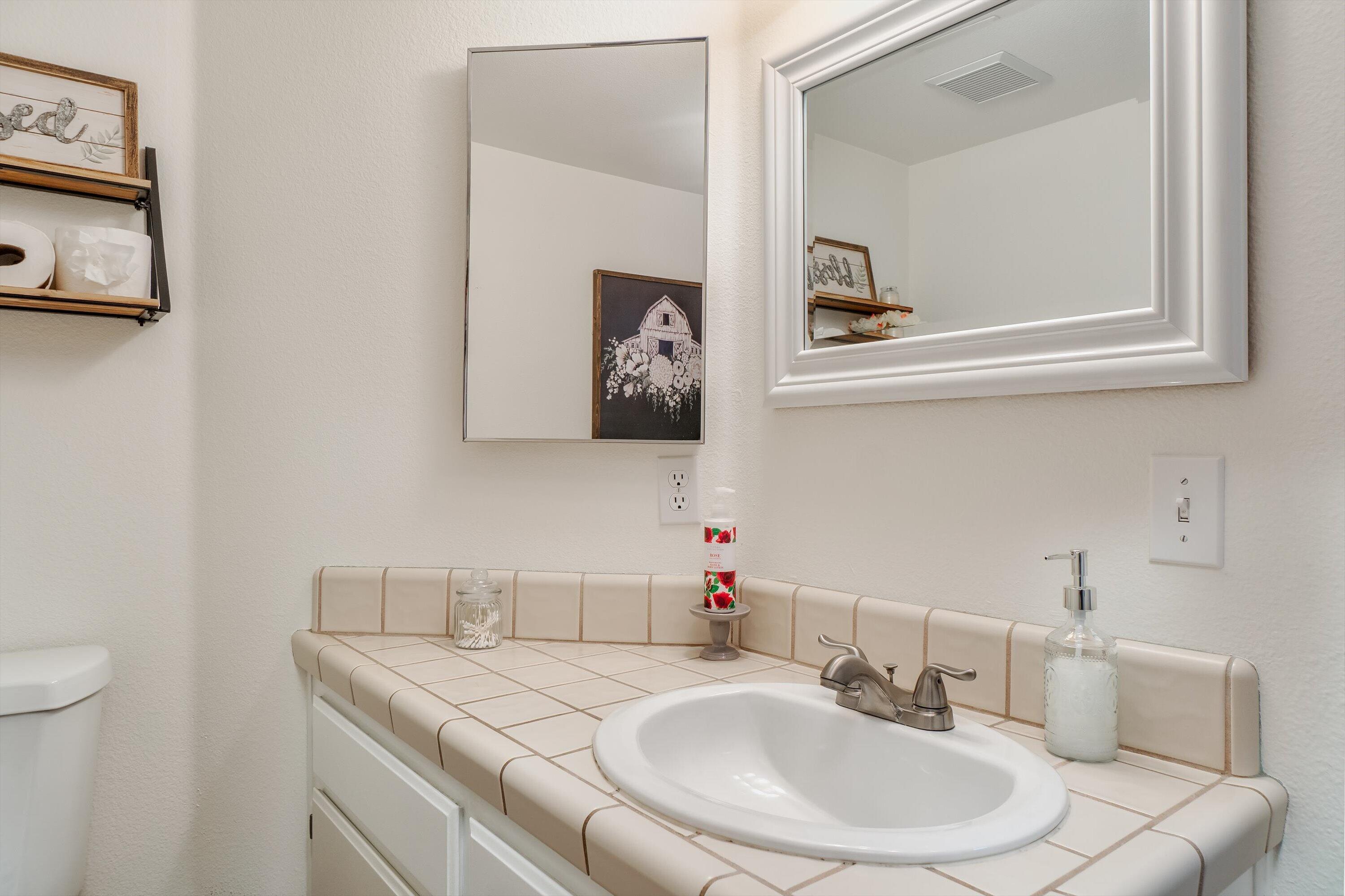 1337 Jason Drive Lompoc, CA 93436 - Photo 10 of 26 a bathroom with a sink and a mirror