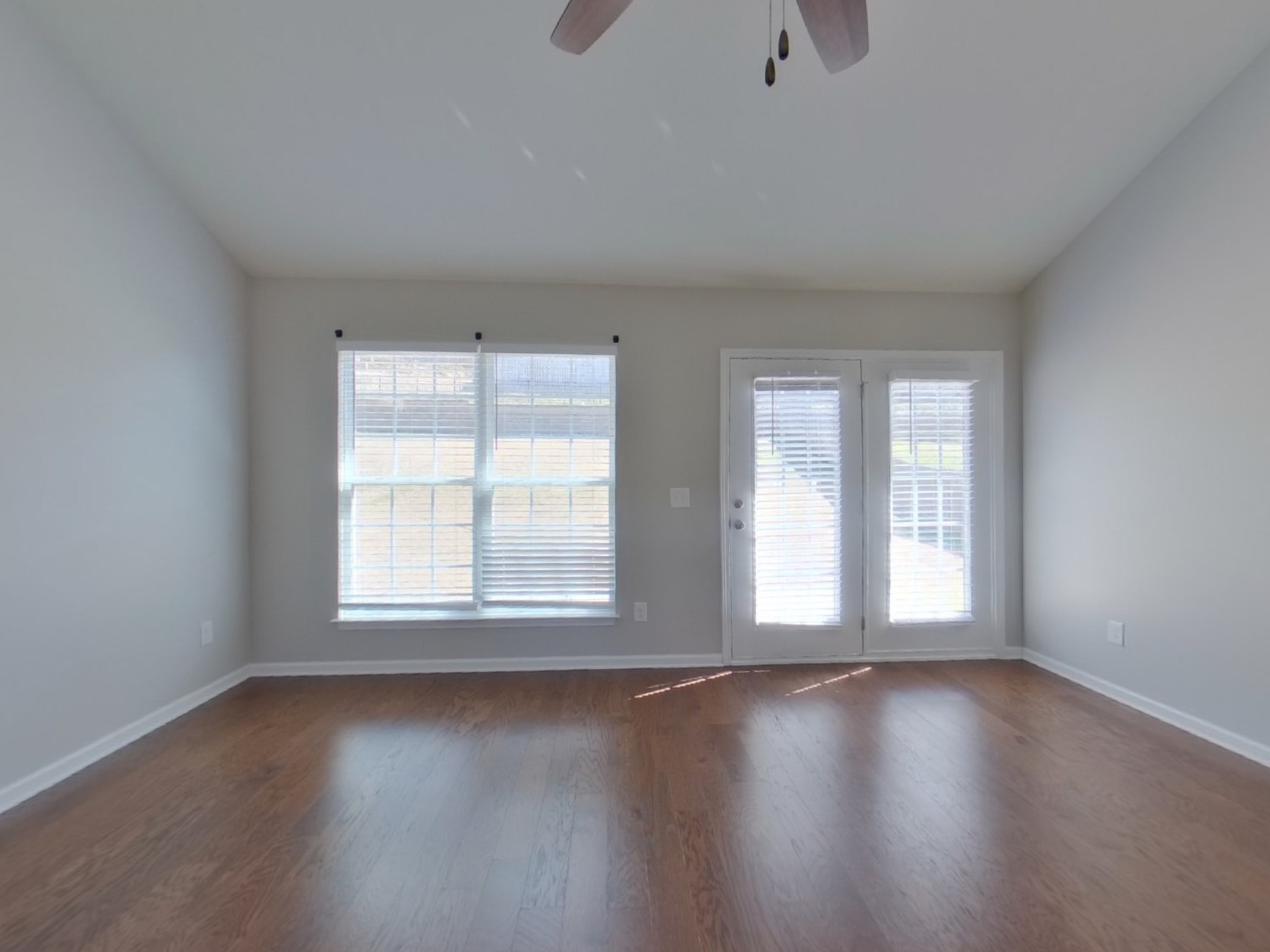 611 Prominence Road Columbia, TN 38401 - Photo 3 of 16 an empty room with wooden floor and windows