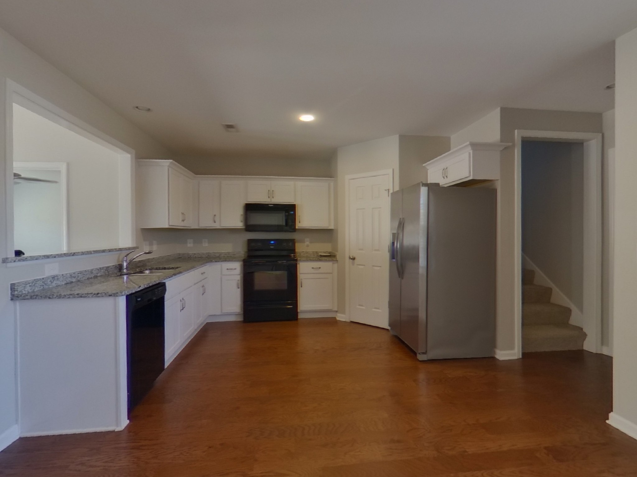 611 Prominence Road Columbia, TN 38401 - Photo 5 of 16 a kitchen with stainless steel appliances granite countertop a refrigerator and a stove top oven