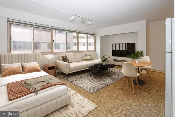 a living room with furniture and a large window