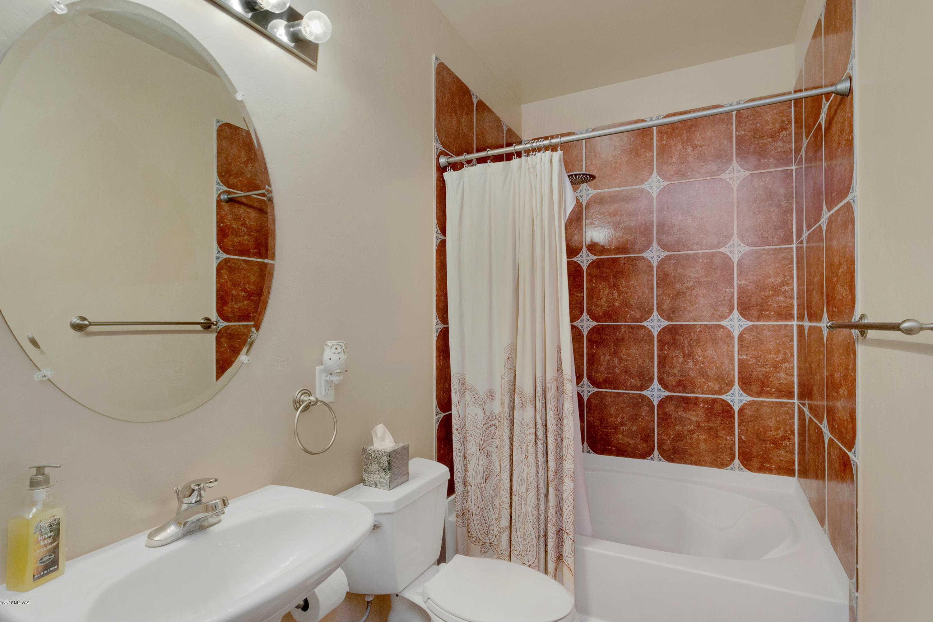 21960 South Helvetia Road Sahuarita, AZ 85629 - Photo 16 of 29 a bathroom with a sink toilet and shower
