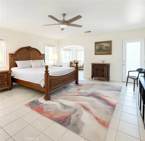 a bedroom with a bed and a fireplace