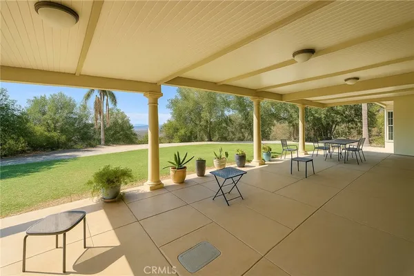 a view of swimming pool with seating area and furniture