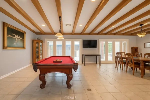 a living room with furniture a table and chairs