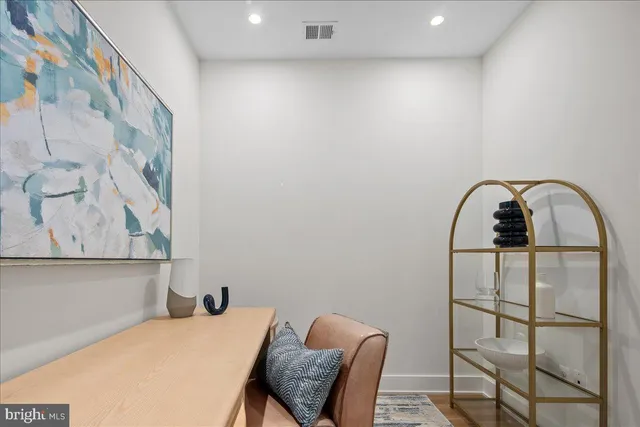 a bedroom with a bed and chair