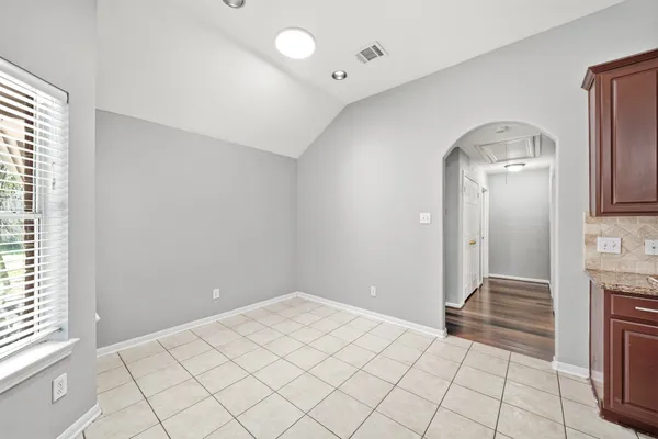 a view of backyard with tub and door