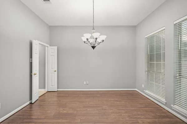 a view of a chandelier in a room with a window