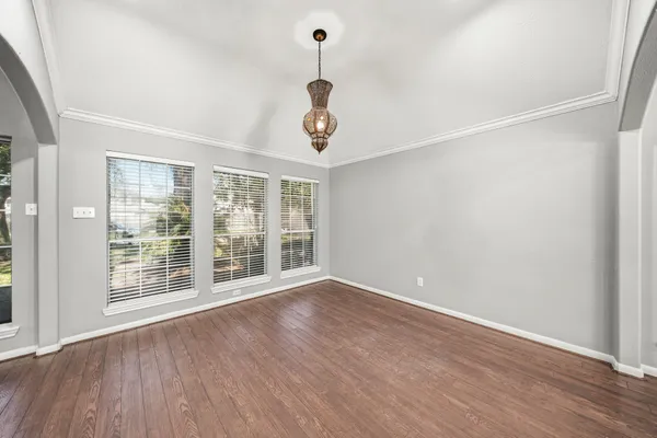 a kitchen with stainless steel appliances granite countertop a stove refrigerator and cabinets