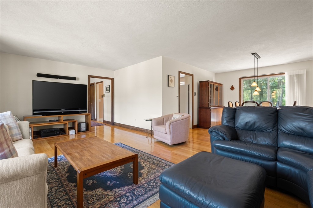10 Idylwilde Road Lexington, MA 02421 - Photo 11 of 42 a living room with furniture and a flat screen tv