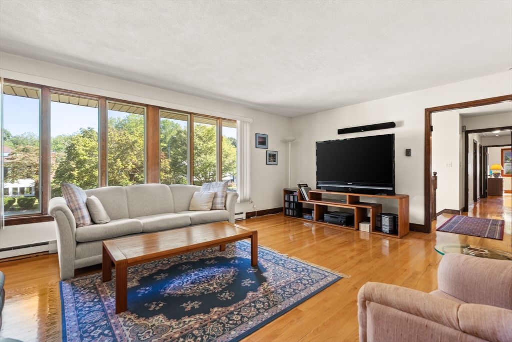 10 Idylwilde Road Lexington, MA 02421 - Photo 12 of 42 a living room with furniture and a flat screen tv