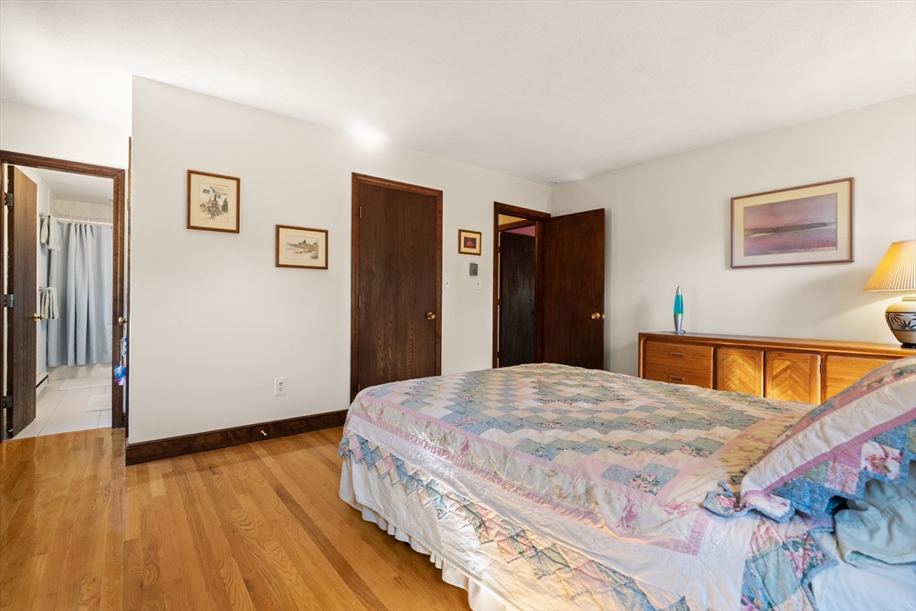 10 Idylwilde Road Lexington, MA 02421 - Photo 21 of 42 a bedroom with a bed and wooden floor