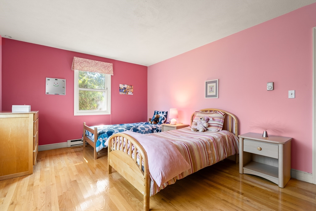 10 Idylwilde Road Lexington, MA 02421 - Photo 25 of 42 a bedroom with a bed and a dresser
