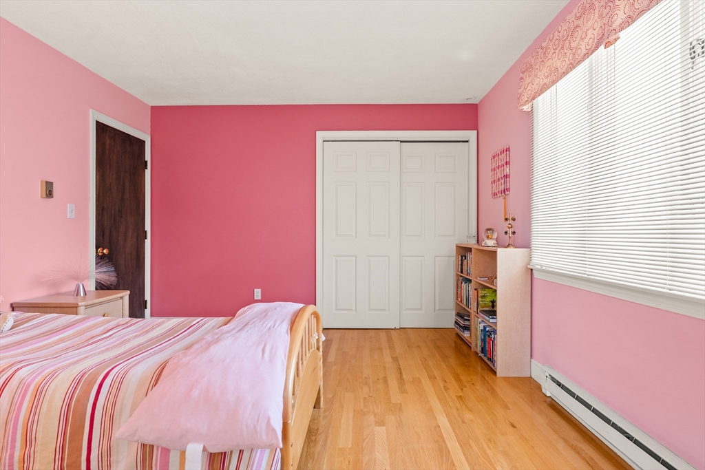 10 Idylwilde Road Lexington, MA 02421 - Photo 26 of 42 a bedroom with a bed and a dresser