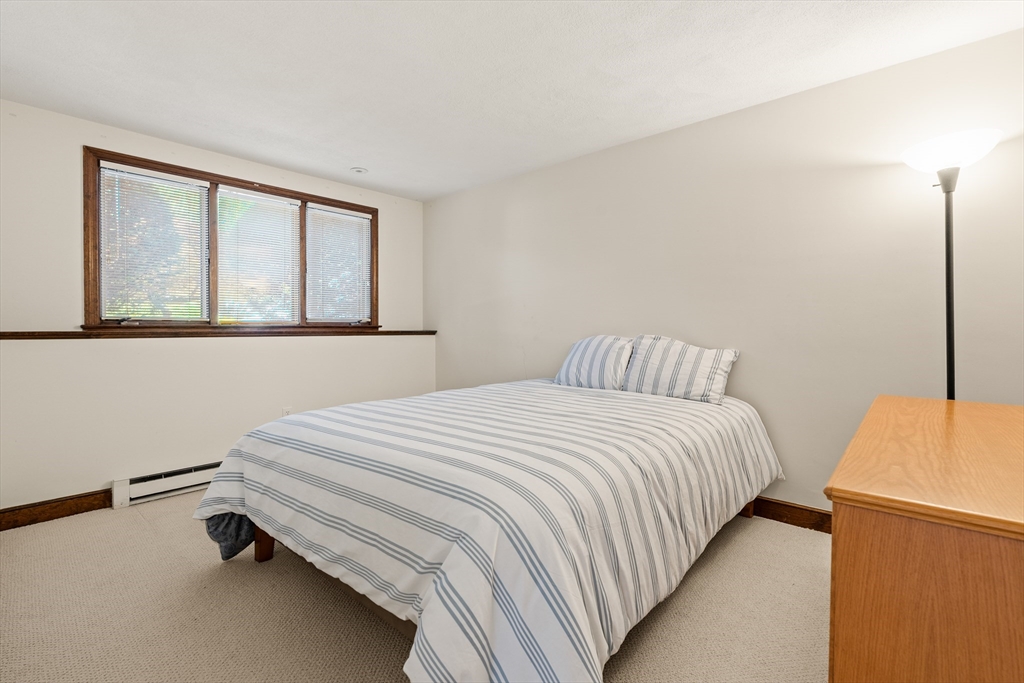 10 Idylwilde Road Lexington, MA 02421 - Photo 31 of 42 a bedroom with a bed and a window