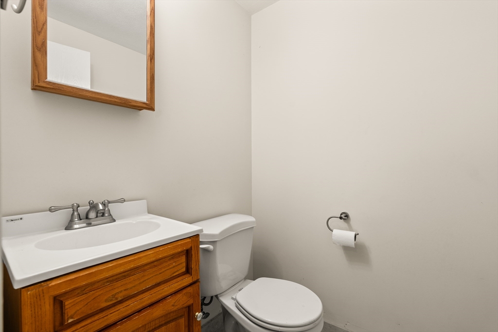 10 Idylwilde Road Lexington, MA 02421 - Photo 32 of 42 a bathroom with a sink a toilet and mirror