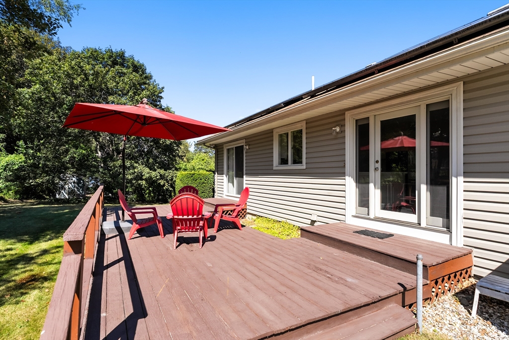 10 Idylwilde Road Lexington, MA 02421 - Photo 33 of 42 a balcony with furniture and umbrella