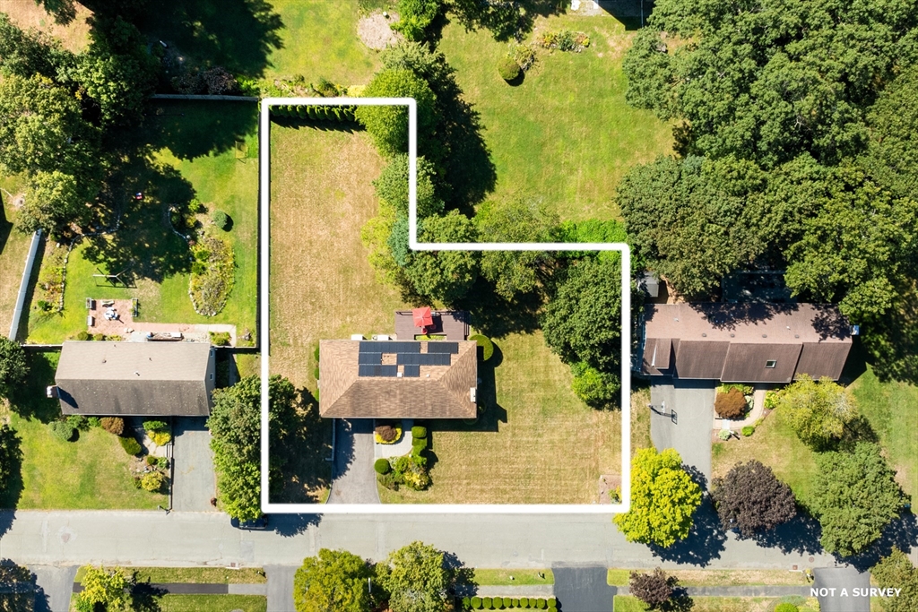 10 Idylwilde Road Lexington, MA 02421 - Photo 5 of 42 an aerial view of a residential houses with yard and swimming pool
