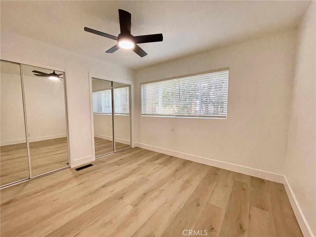 821 Calle Puente, Unit 3 San Clemente, CA 92672 - Photo 4 of 11 a view of empty room with wooden floor and fan