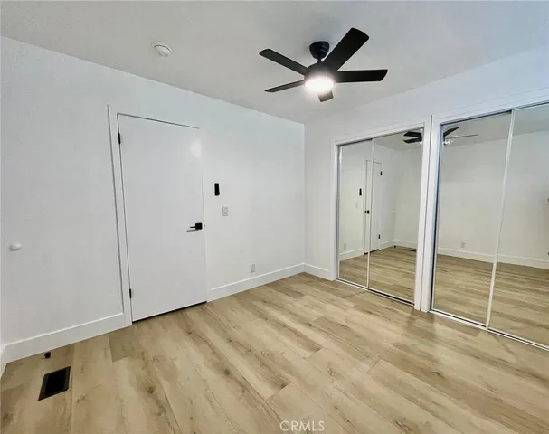 a white toilet sitting next to a white sink